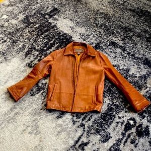 Banana Republic, size small, tan leather jacket, taken in for slim fit.